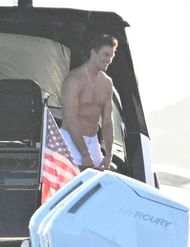 Another shot of Tom Brady standing shirtless in his yacht (via Backgrid for Page Six)